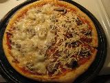 Against The Grain Gourmet Pizza Shell topped with mushrooms and mozarella/Diaya vegan mozzarella cheese Against The Grain Gourmet Pizza Shell topped with mushrooms and mozarella/Diaya vegan mozzarella cheese